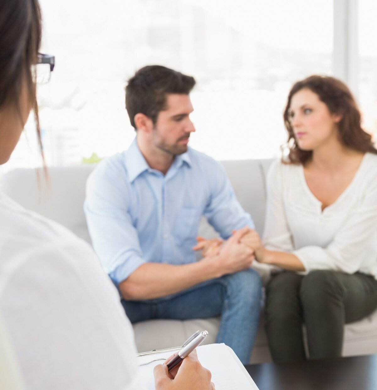 Evidence-based marriage therapy session with a couple and therapist